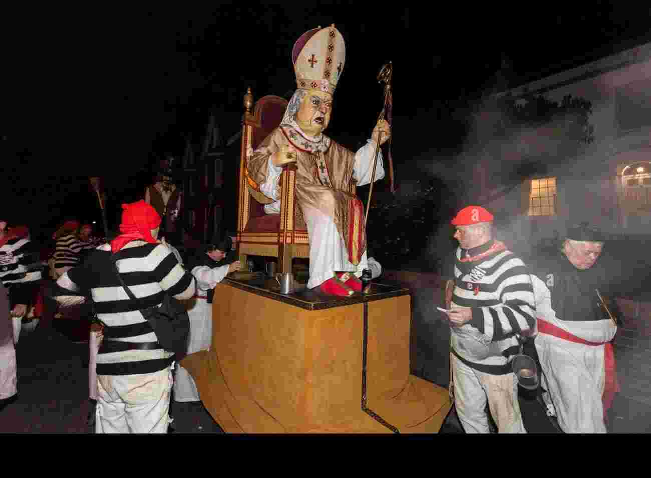 effigy of the pope being carried to a bonfire